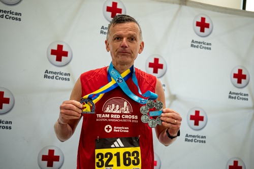 team red cross participant with medal 
