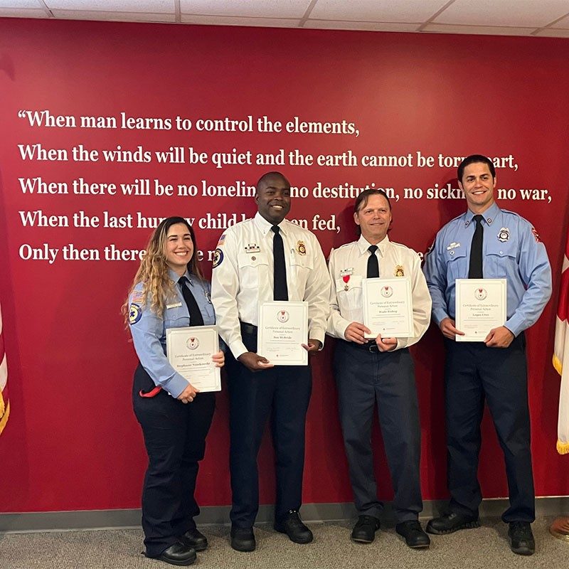 Firefighters holding American Red Cross Certificate of Extraordinary Personal Action.
