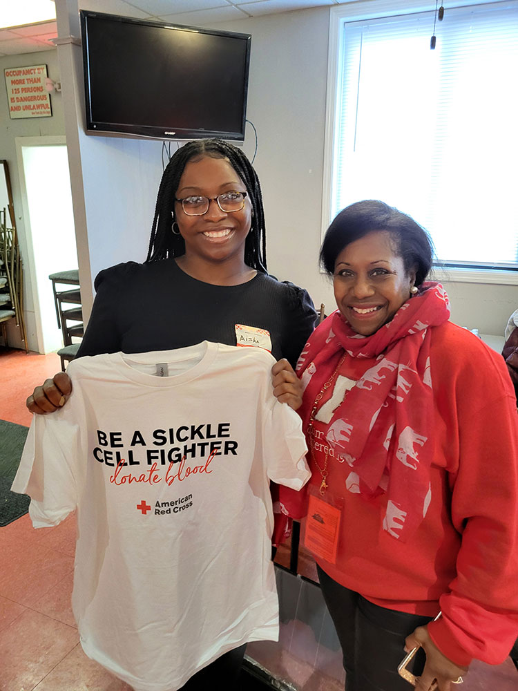 Aisha Sutton poses with Dr. Angela Green after donating blood.