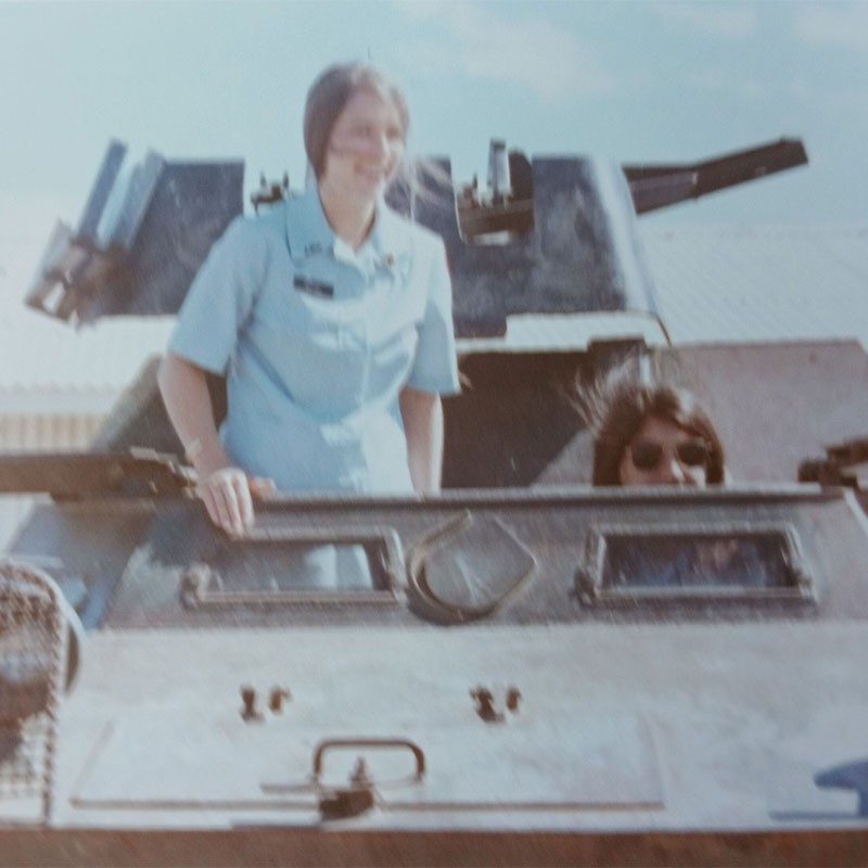 2 women in military vehicle