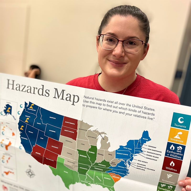 Woman holding hazards map
