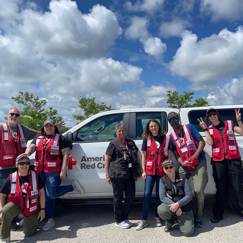 Red Cross volunteers group pic in front of Red Cross truck in Casper.