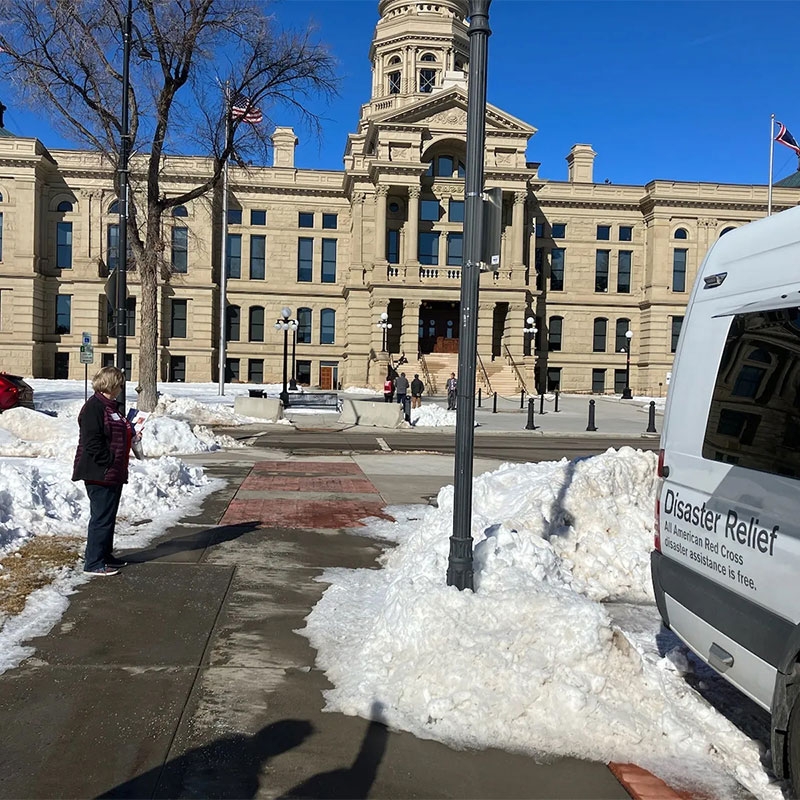 Wyoming State Capitol building with snow on the ground.