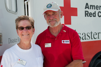 Two Red Cross volunteers smiling for camera
