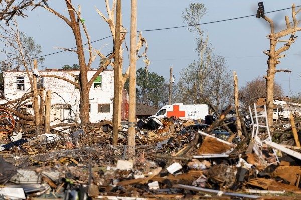 Red Cross volunteers drive to the scene of tornado damage