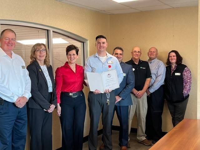 Kevin Barcelos pictured with members of the Red Cross Connecticut and Rhode Island Region.