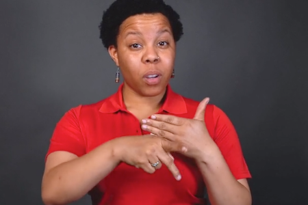 Woman giving fire safety tips in sign language
