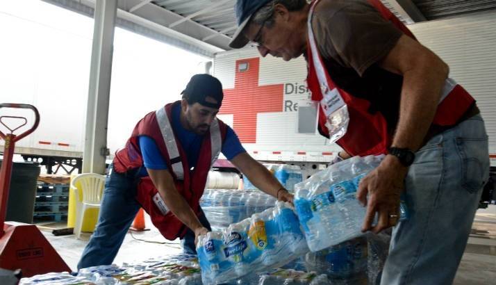 Hurricane Harvey - Volunteers unload water from a truck