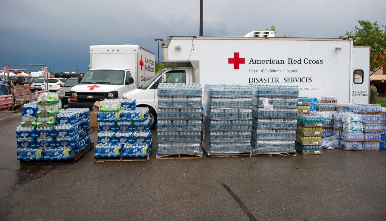 Cases of water outside of the American Red Cross Disaster Services trucks.
