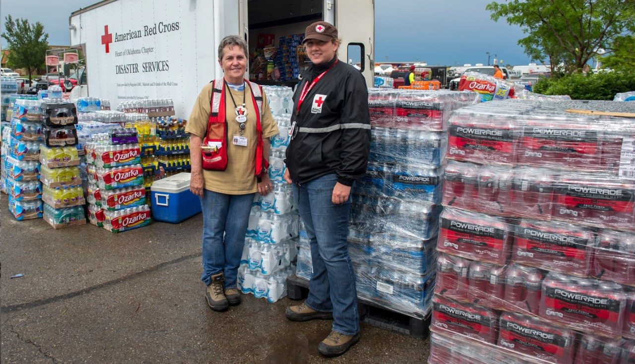 Red Cross volunteers Doris Baker (left) and Tiffany Stuhr (right) from Oklahoma help distribute supplies in the affected communities.