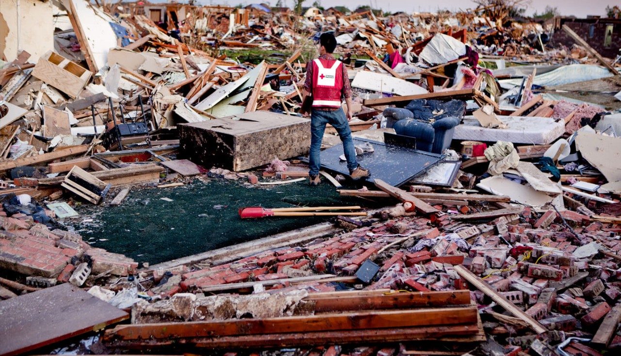 A Red Cross worker assesses the destruction inflicted upon Moore, Oklahoma.