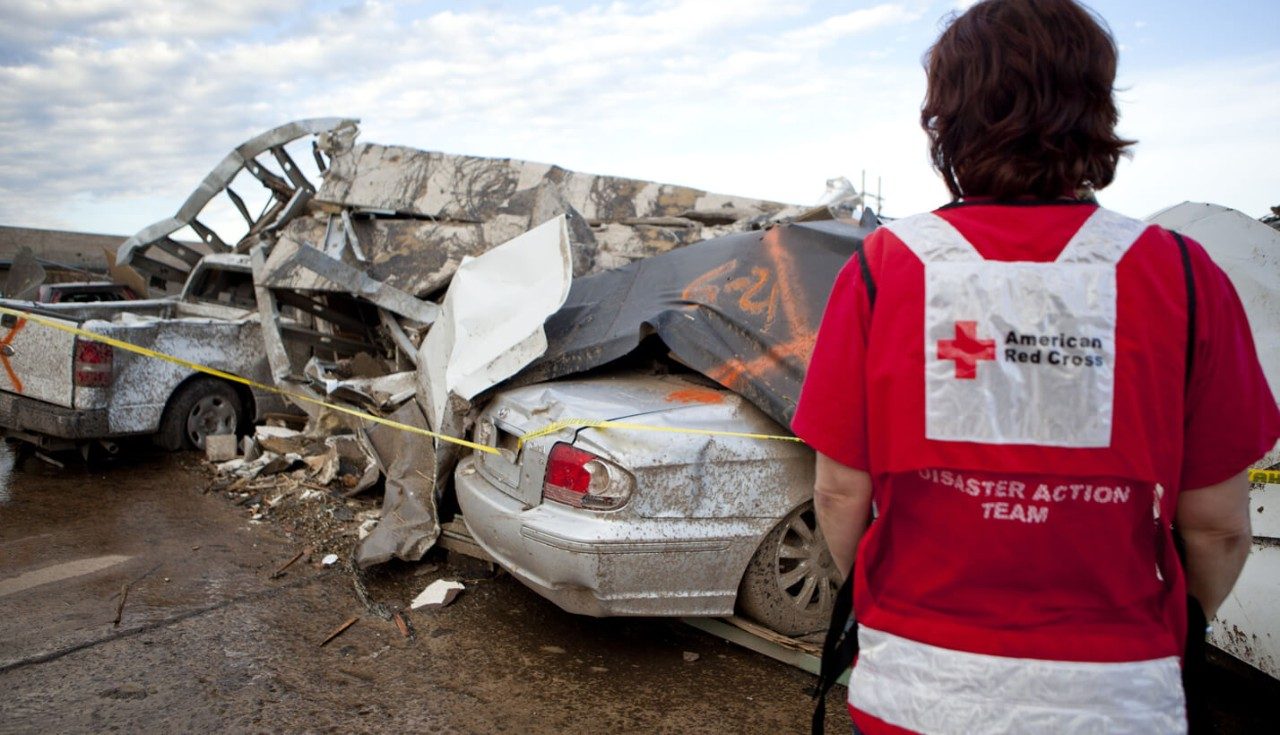 A Red Cross volunteer assesses the devastation caused by the tornado.
