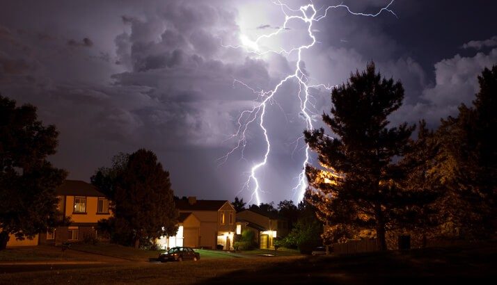 Lightning striking over home