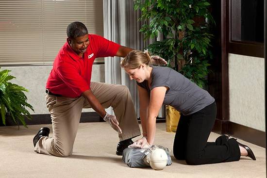 StayWell PHSS stock photography.  CPR Training Chest Compressions.