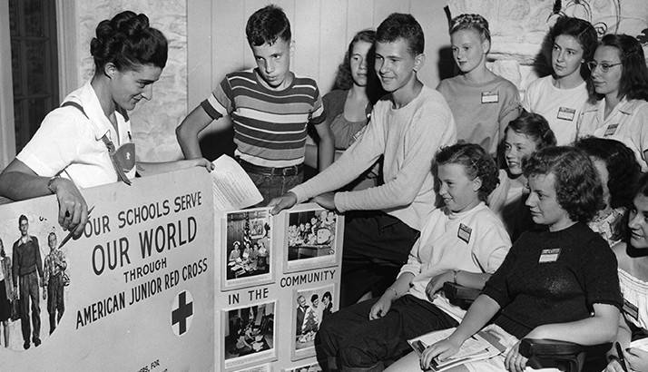 Date: July 1948     Event: Junior Red Cross Camp    Location: Camp Bynden Wood, Pennsylvania    Photographer: Clifford Veich    Release info: no release needed

CAPTION: Camp Bynden Wood, Pennsylvania, July, 1948--To train for leadership in Junior Red Cross, 160 teen-agers met during July at Camp Bynden Wood, Penn. In this photo, Fronia Davidson of Red Cross Eastern Area discusses the use of posters and pictorial exhibits in publicizing activities of the Junior Red Crossers. Boys and girls attending the camp came from Canada, Pennsylvania, Ohio, Maryland, Virginia, West Virginia, Kentucky, Indiana, and the District of Columbia. (American Red Cross photo by Clifford Veich) 

Archive # 4620