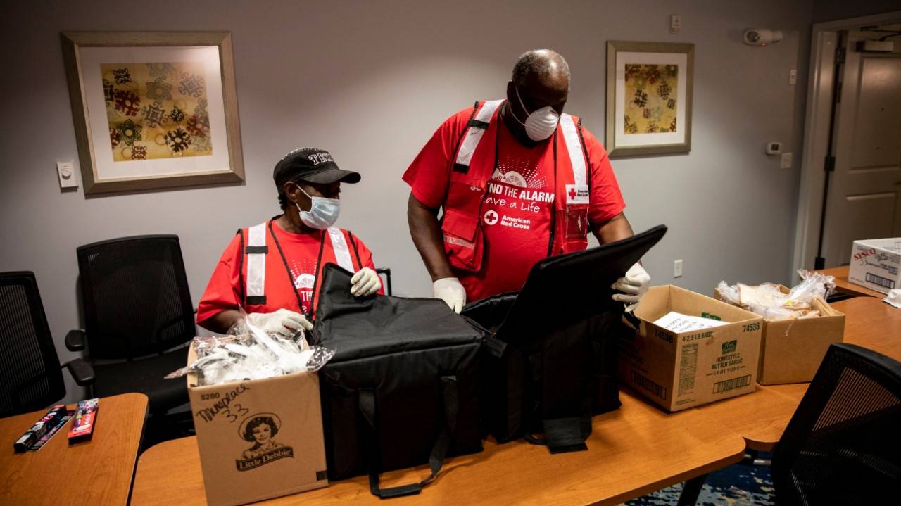 April 17, 2020.  Monroe, Louisiana.Sandra White and Roland Jones of the American Red Cross check on meals that were prepared for families at a hotel for people affected by a recent tornado in Monroe, LA on Friday, April 17, 2020. Photo by Scott Dalton/American Red Cross