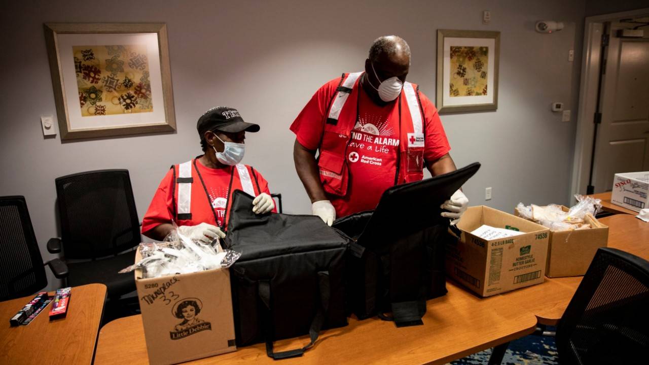April 17, 2020.  Monroe, Louisiana.
Sandra White and Roland Jones of the American Red Cross check on meals that were prepared for families at a hotel for people affected by a recent tornado in Monroe, LA on Friday, April 17, 2020. 
Photo by Scott Dalton/American Red Cross