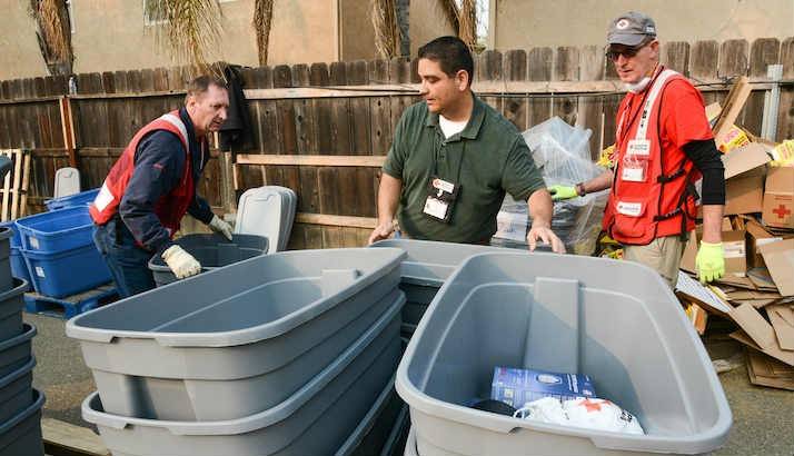 Red Cross volunteers work together in Yuba City, CA to produce Wildfire Relief Kits to be distributed to residents affected by the Camp Fire.