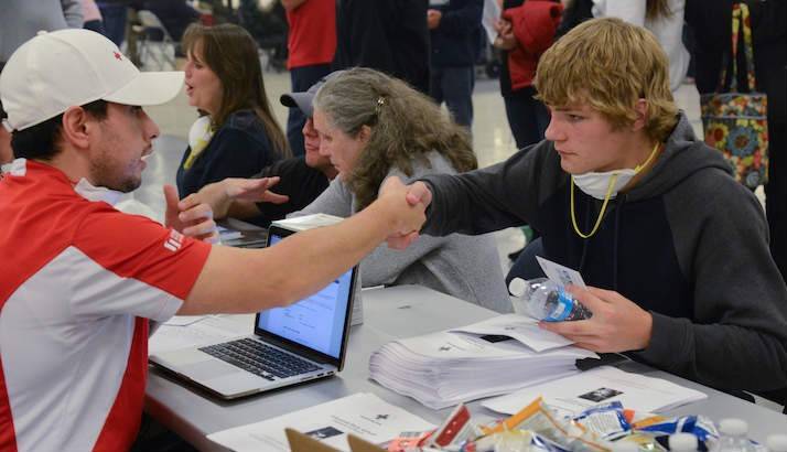 Red Cross worker Javanny Perez, talks with Stuart Glass at the Local Assistance Center in Chico, California.