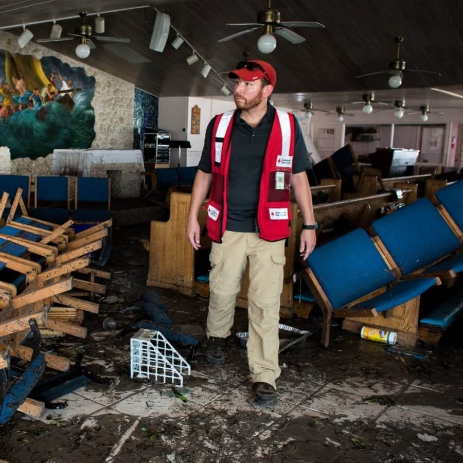 A Red Cross volunteer assesses the damage in impacted neighborhoods.