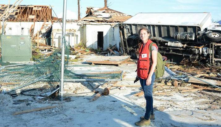 A Red Cross volunteer surveying damage caused by Hurricane Dorian.