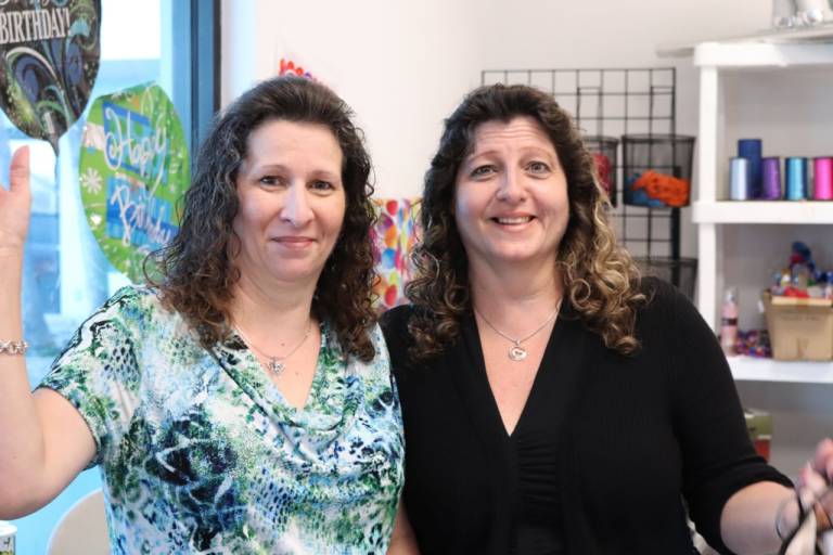 Charlene Russell and her sister Marla Kay inside of their business in Abaco, Bahamas.