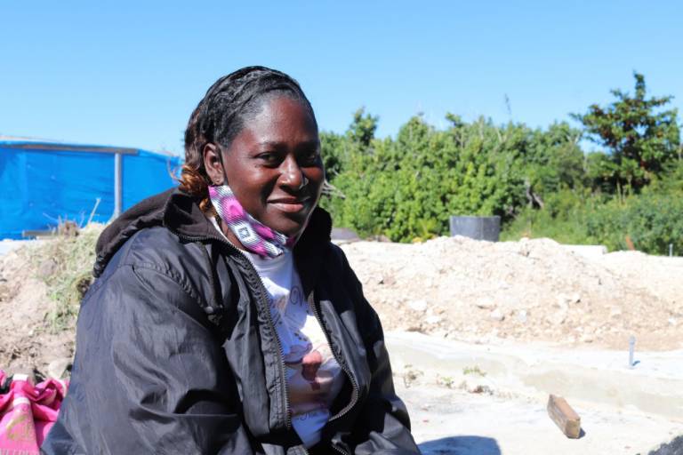 Neceva Roberts sits outside.