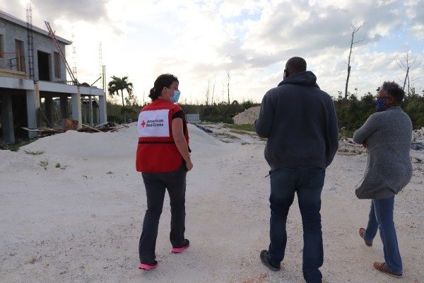 A Red Cross volunteer works with families affect by Hurricane Dorian in the Bahamas