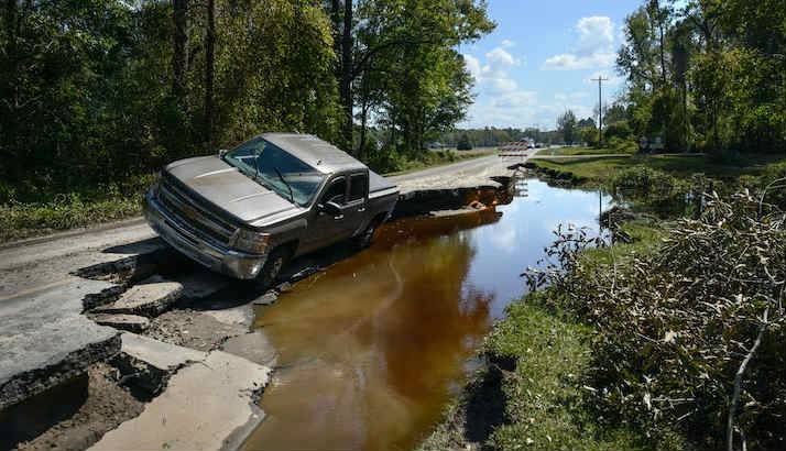 A truck leaning into a sink hole in North Carolina.