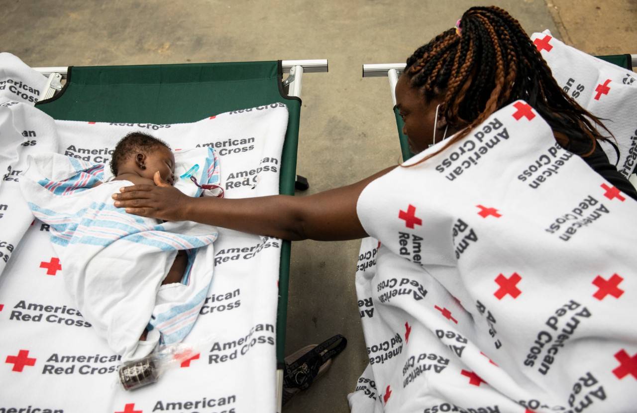 August 28, 2020. Alexandria, Louisiana.
Cassandra comforts her baby Chaya, 2 months old, at an American Red Cross shelter in Alexandria, LA on Friday August 28, 2020. Cassandra and Chaya were among 85 people at the shelter who were also displaced from their homes by Hurricane Laura.
Photo by Scott Dalton/American Red Cross