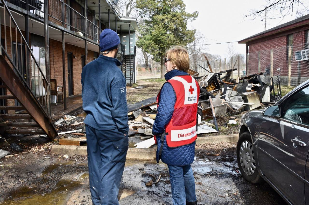 February 20, 2020. Memphis, Tennessee. An apartment resident who has been displaced from his home due to fire shares his story of escape with American Red Cross volunteer Lana Wallace. Volunteers from the Mid-South chapter of the Red Cross responded to the multi-unit apartment fire. Six families lost their homes due to the fire that the Memphis Fire Department determined was due to a faulty heating system in a utility closet. Thankfully, all the residents escaped without suffering severe injuries. The Red Cross provided assistance to the six displaced families.Photo by Bob Wallace/American Red Cross 