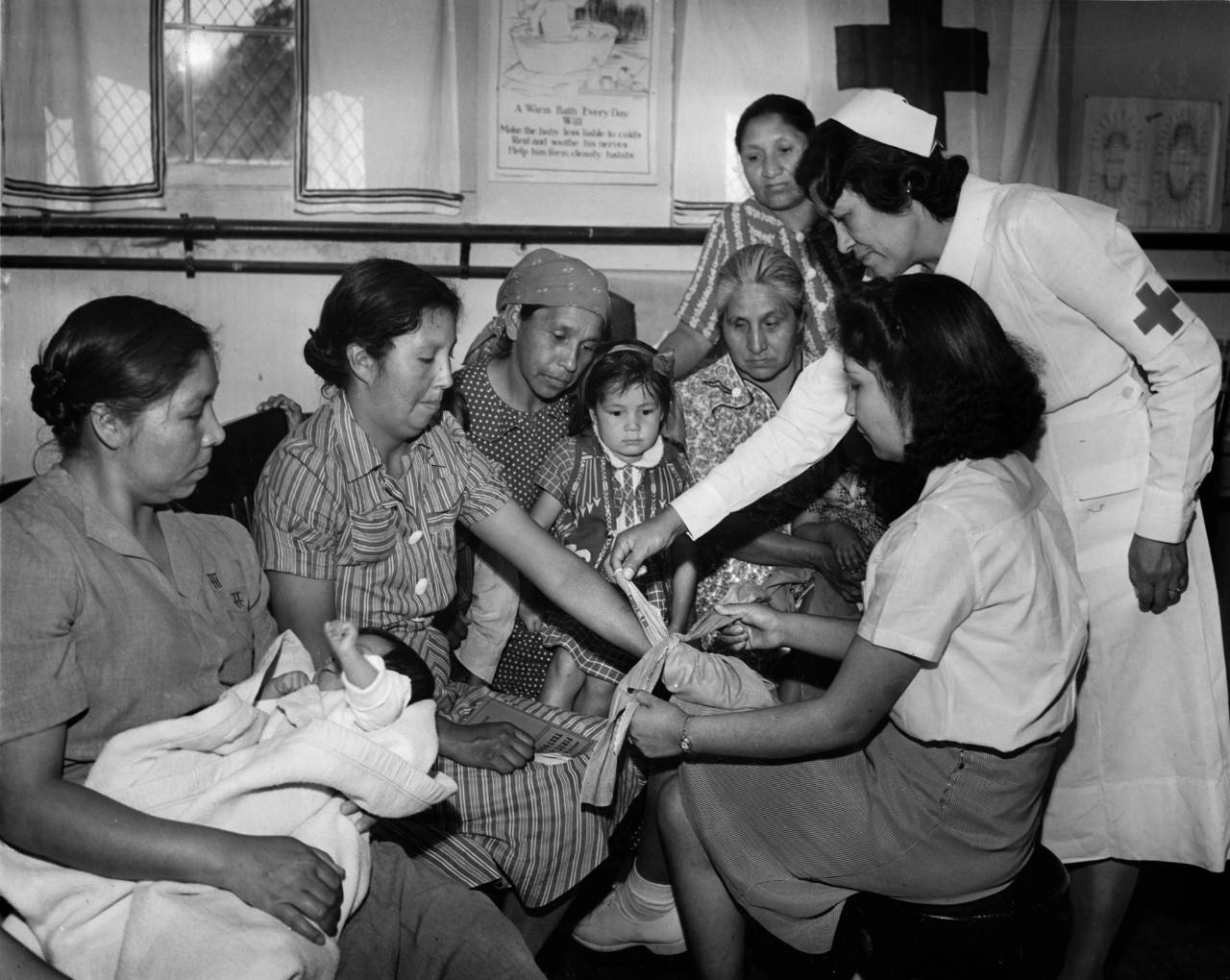 Red Cross Nurse Lula Owl Gloyne teaches the Red Cross Standard First Aid Course to women on the Cherokee Indian Reservation in North Carolina. Gloyne also served as a Red Cross Nurse during WWI. The American Red Cross created its First Aid Department on October 9, 1909. Red Cross Historical Photo.