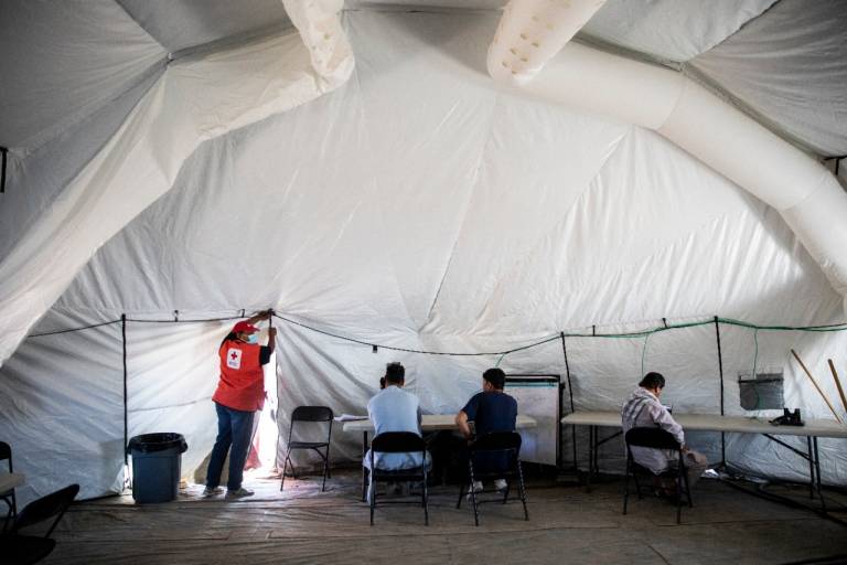 volunteer helps evacuees