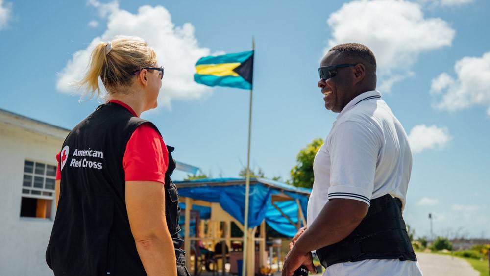 Sweetings Cay resident Shervin Tate smiles with Holly Baker of the American Red Cross 