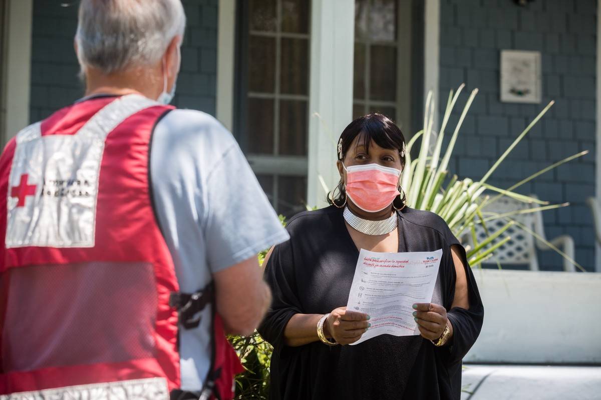 May 8, 2021. Savannah, Georgia. During a Sound the Alarm day of action visit at the doorstep of Savannah resident Helene Byrd, longtime Red Cross disaster volunteer Robert Brown discussed the importance of smoke alarms and having a home fire escape plan. Both Byrd and Brown remember a tragic house fire that took the lives of two neighborhood children just a few years ago. “If everybody in the neighborhood was informed about fire safety four years ago, those two children who lost their lives might still be alive today,” said Byrd, who intends to practice her fire escape plan with her family as a result of the visit. Photo by Stephen B. Morton/American Red Cross