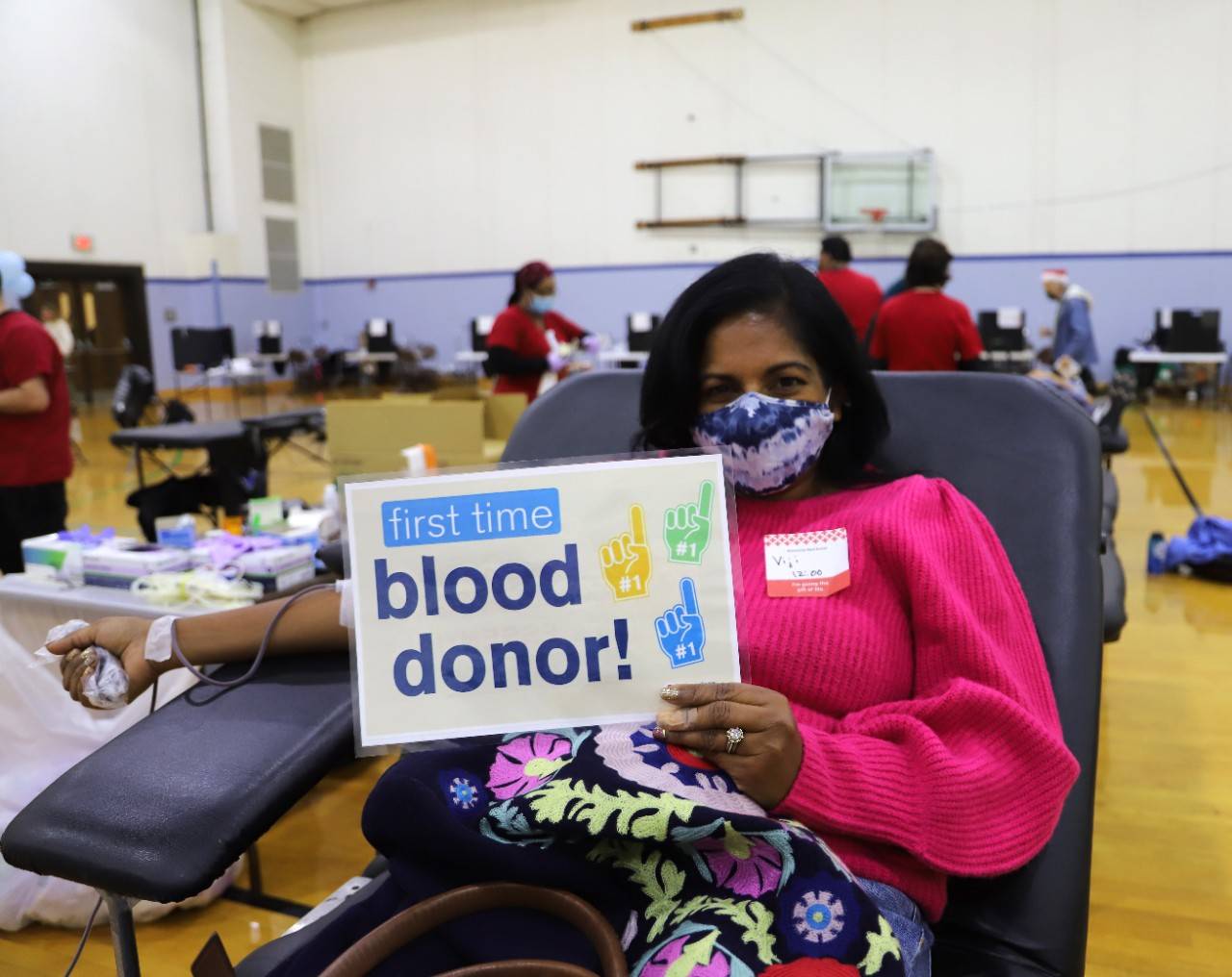 December 8, 2021. Chapel Hill, North Carolina. First time blood donor Viji Sathy of Chapel Hill, NC donates blood at the Holiday Carolina Blood Drive on 12-8-2021 at the University of North Carolina Chapel Hill. Photo by Steve Pippenger/American Red Cross.