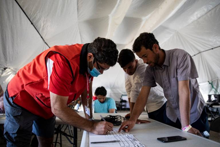 volunteer helps evacuees at call center