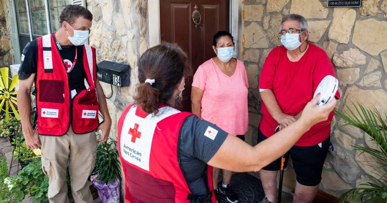 May 8, 2021. San Antonio, Texas.
Red Cross volunteers Celeste Carrola and Benjamin Quick share home fire safety information with Gerald Davis as part of the Sound the Alarm day of action on May 8, 2021.  Davis made a Sound the Alarm appointment with the Red Cross because he wanted his home to be safer.  I cannot thank you all enough for being here today,  Davis said.  It means so much. And I am going to tell my neighbors about this, so expect some calls! 
Photo by Scott Dalton/American Red Cross