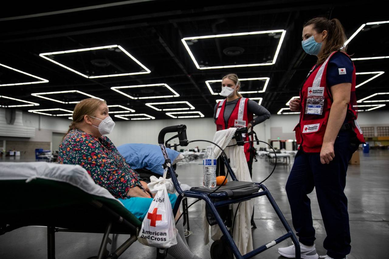 September 14, 2020. Portland, Oregon.
Kathy Gee speaks to American Red Cross nurses at an American Red Cross shelter in Portland, OR after fleeing her home because of wildfires in the region on Monday, September 14, 2020.
Photo by Scott Dalton/American Red Cross