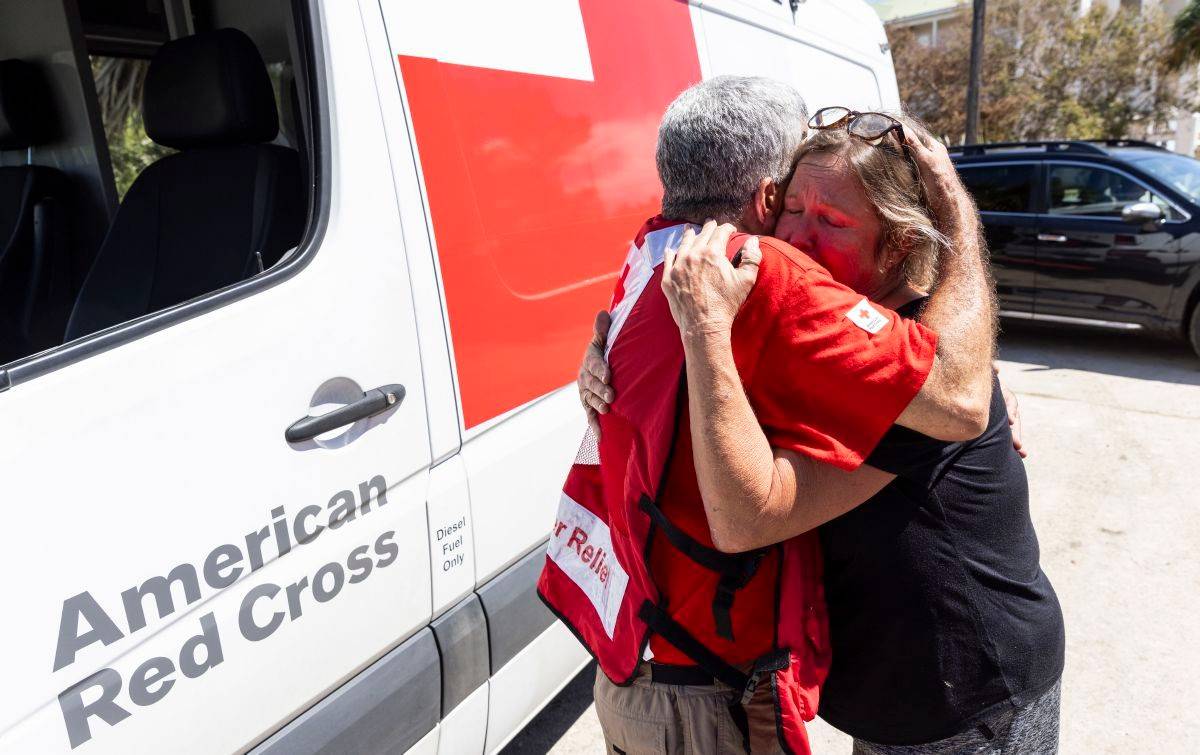 August 31, 2023. Horseshoe Beach, Florida.
Red Cross disaster responder, Joe Apicello, comforts Horseshoe Beach, Florida, resident Julie Thomas. With their emergency response vehicle, Red Cross volunteers are delivering food and supplies in hard-hit neighborhoods after Hurricane Idalia. Recalling the last few days and the devastation wrought by the storm, Julie said  I ve never seen anything like this.  As a result of the climate crisis, hurricanes are becoming more intense and more destructive with increased rainfall and higher storm surges.
Photo by Scott Dalton/American Red Cross