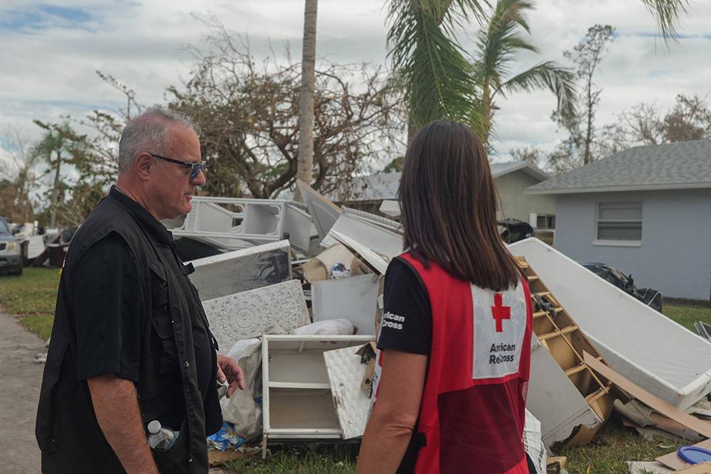 Brad Kieserman, vice president, Disaster Operations and Logistics, and Red Cross worker 