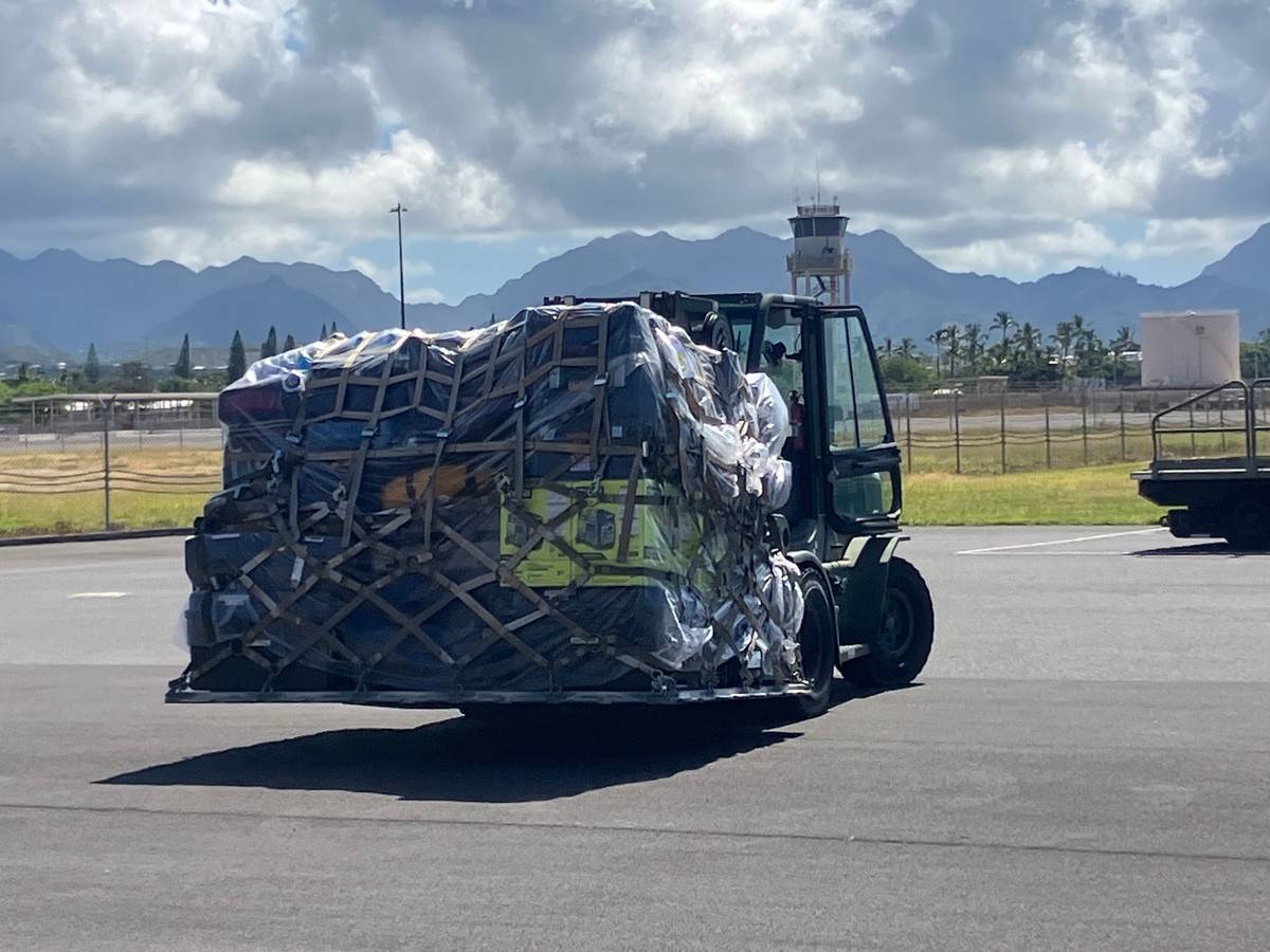 supplies are loaded onto planes in Honolulu