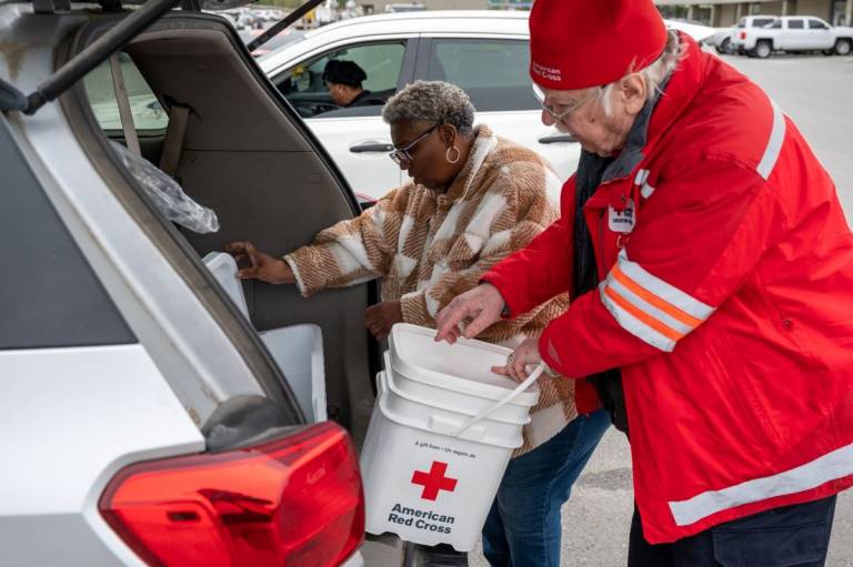 Samella Drayer of North Little Rock, AR stops in the nearby town of Sherwood to pick up cleanup supplies she needs for her home