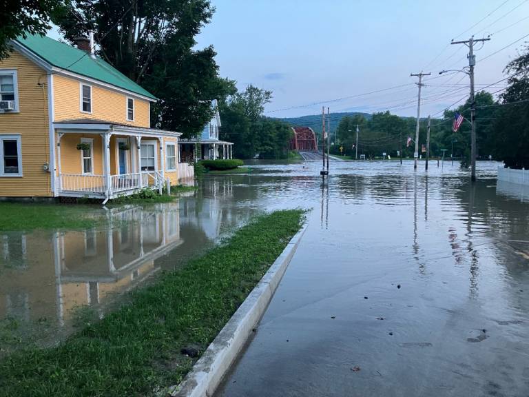 Floodwaters engulf this area of Richmond, Vermont. The danger isn’t over ─ more rain is headed to the area this week.