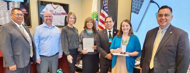 Courtney Cosby (second from right) received a Lifesaving Award for saving her son’s life. Tammy Lewis (middle), who was Courtney’s instructor, was also honored.