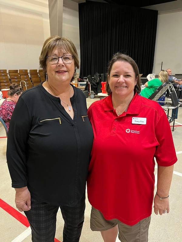 Pictured with fellow Red Crosser Julie Brady, Tracy hosted a blood drive to celebrate how blood donations helped save her life.