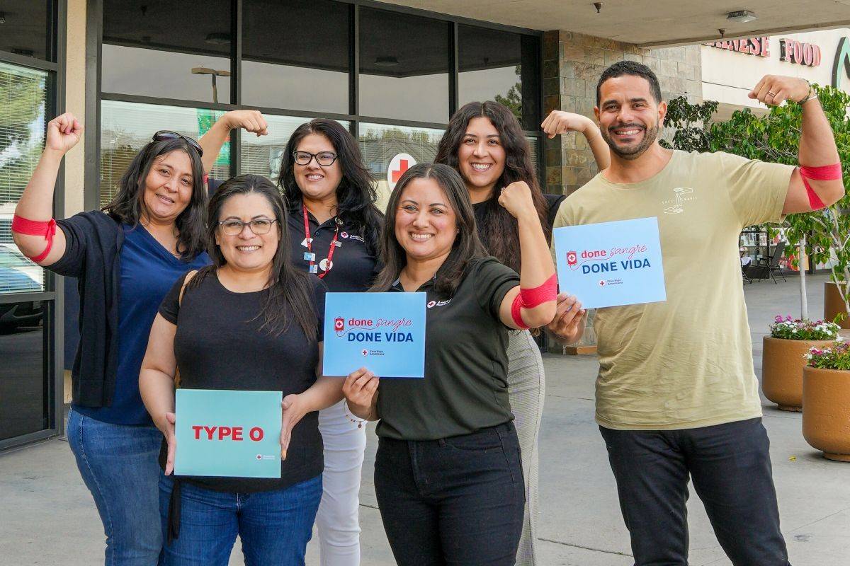 Group of young blood donors in front of a blood donation center