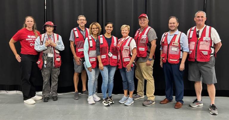 American Red Cross volunteers Palisa Williams Rushin and Anne Cockley respond to home fires together on the Disaster Action Team.