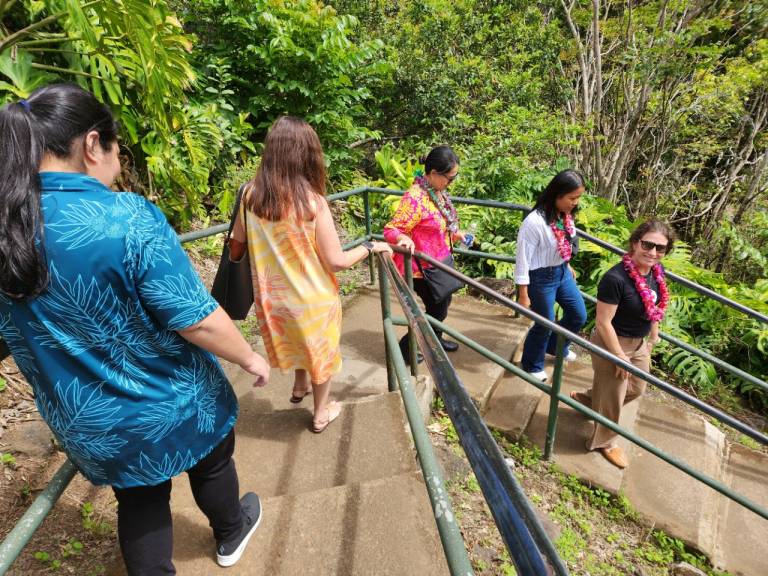 group of people pose for outdoor photo