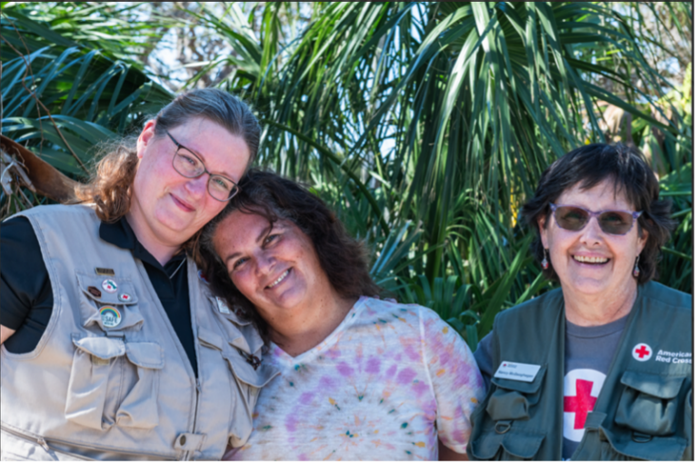 – three women, two in Red Cross vests